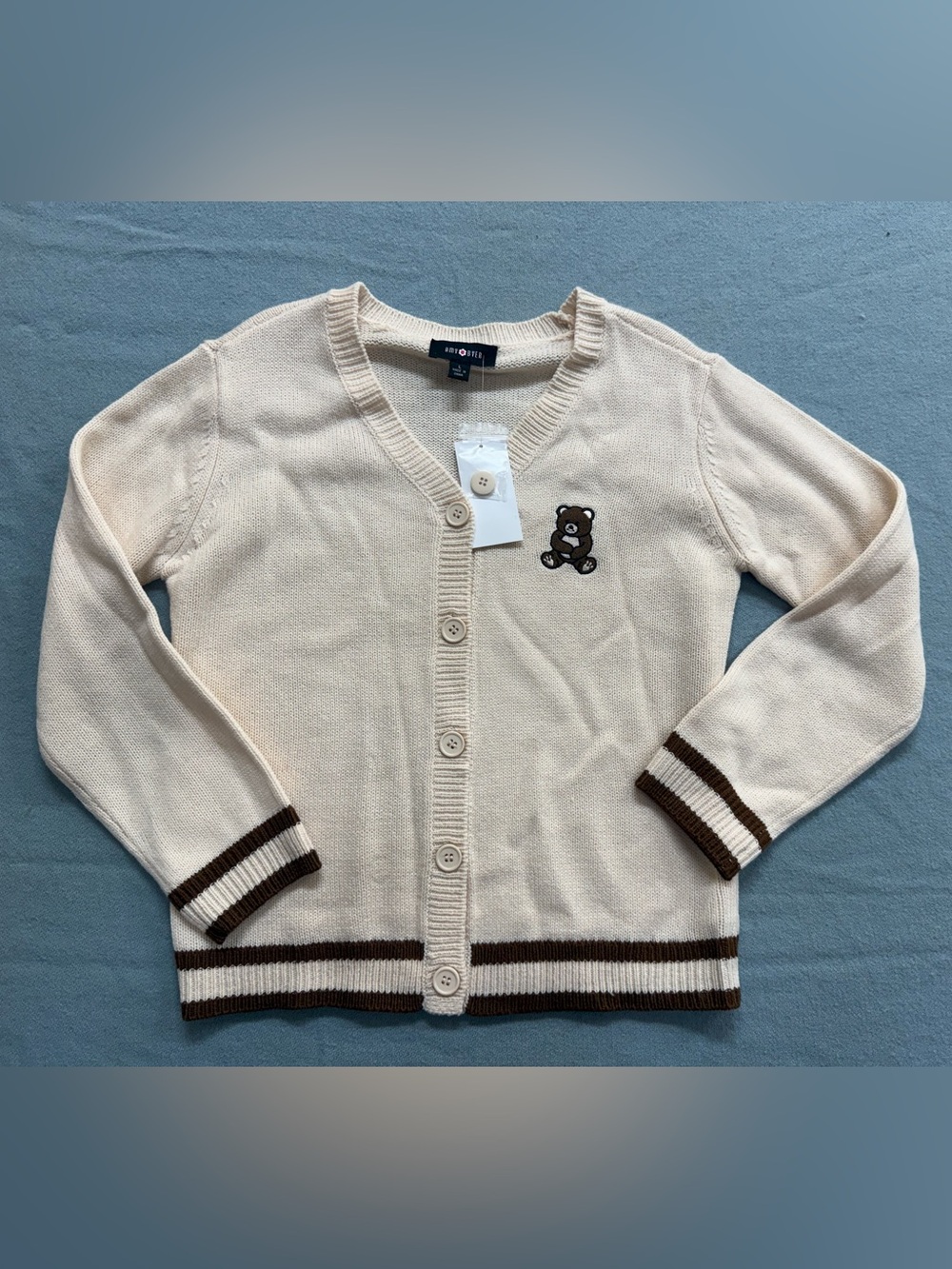 Amy Byer Cream Button Cardigan with Brown Trim and Teddy Patch